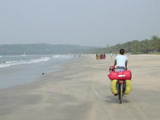 Cycling on the beach in Kerala, India